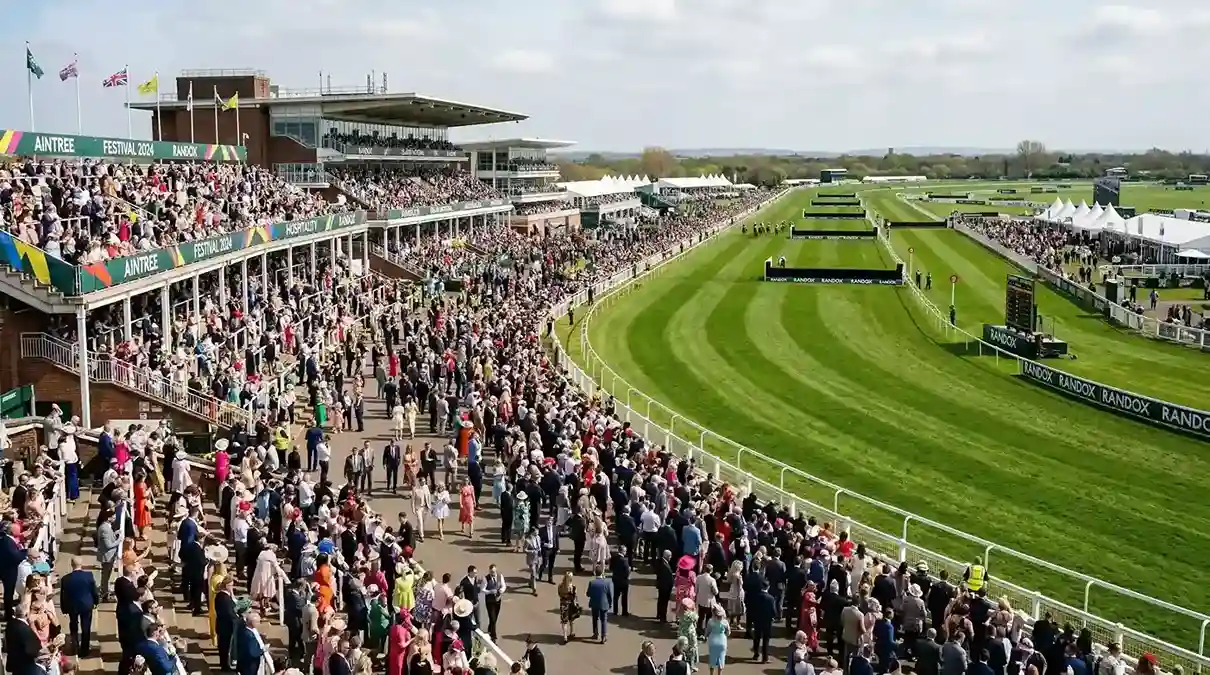 Wide view of Aintree racecourse during the Festival with packed stands
