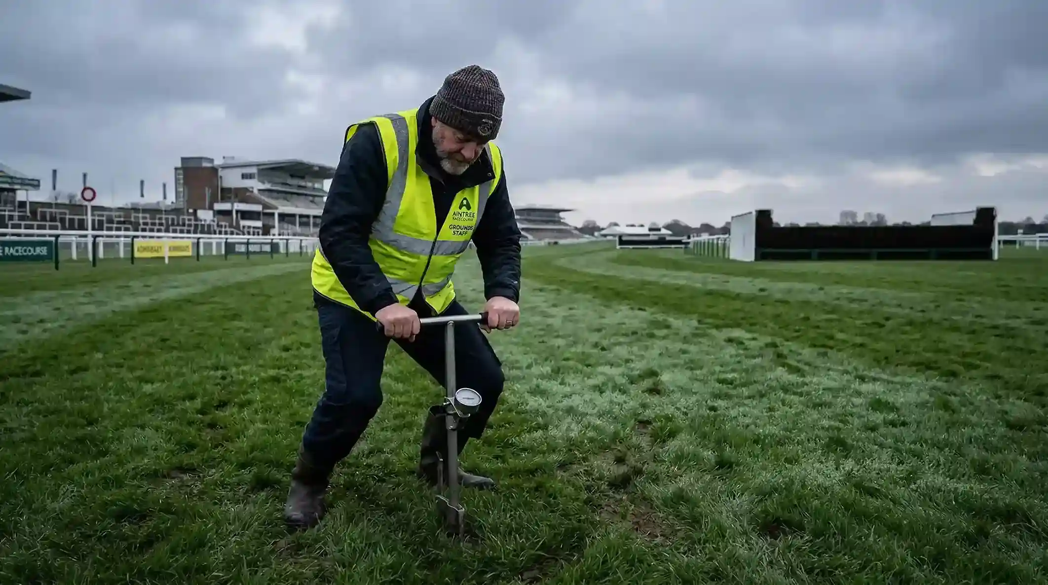 Groundsman testing the Aintree turf with a penetrometer before the Grand National